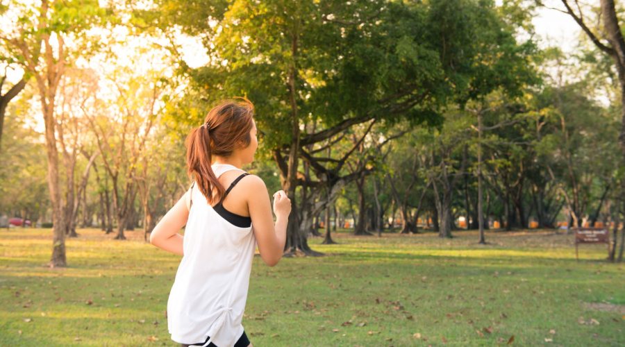 woman about to run during golden hour