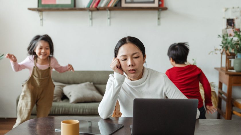 kids making noise and disturbing mom working at home