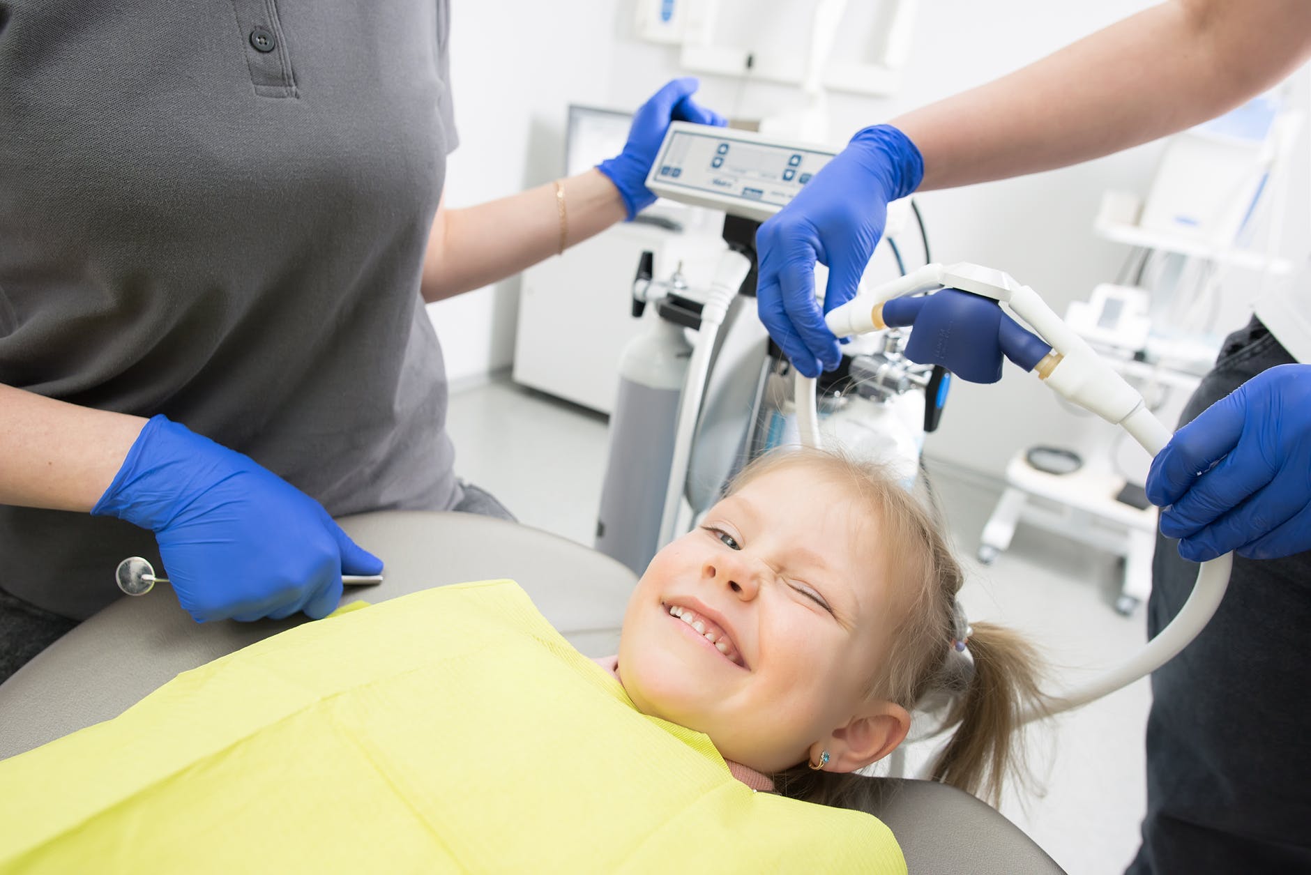 girl smiling on dental chair